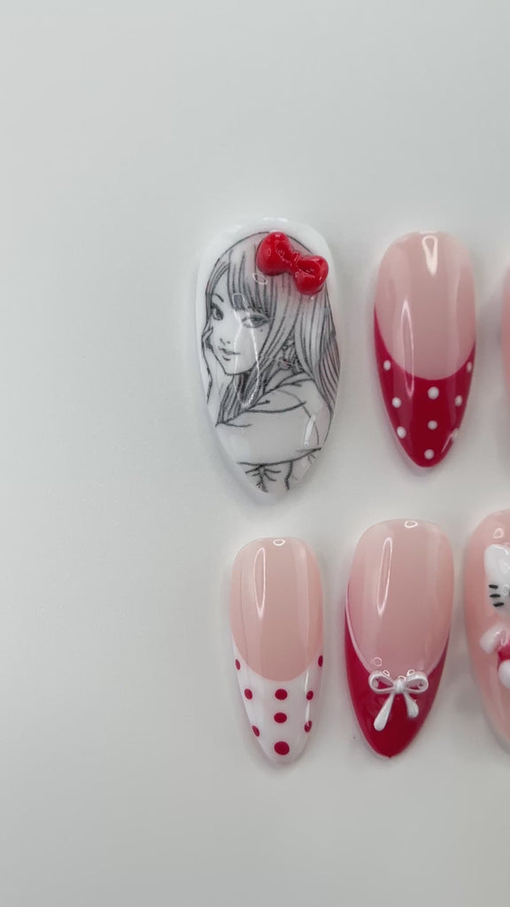 Video showing Rai's House of Nails 3D white kitty press on nails in motion, with the sculpted bows and charms catching the light.