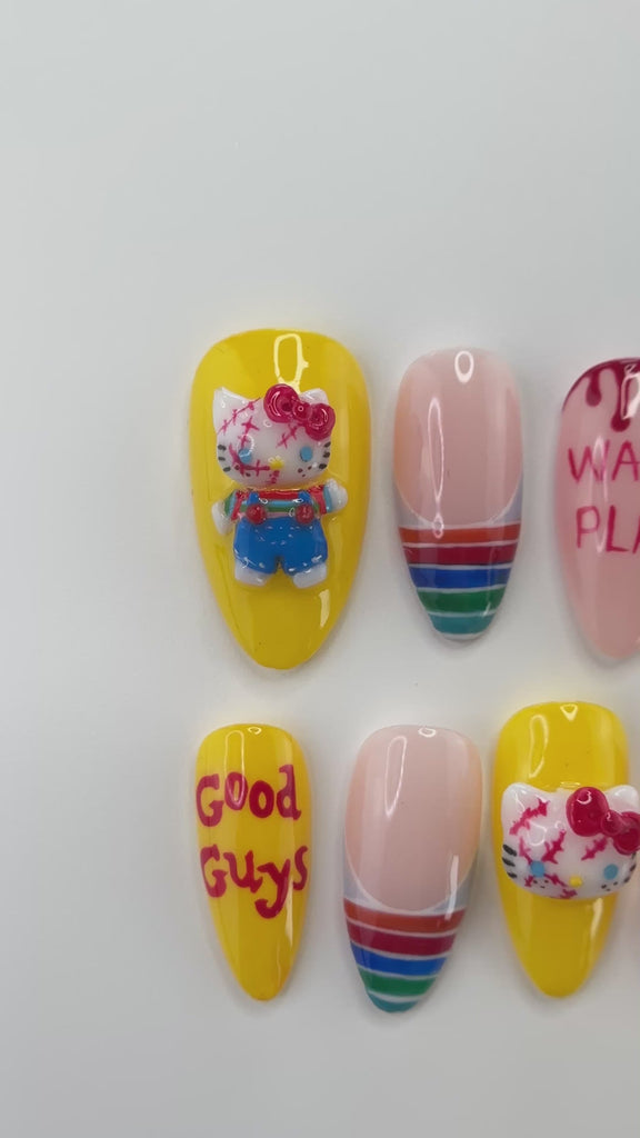 Video showing Rai's House of Nails killer doll press on nails in motion, with the sculpted white kitten charm, bow, and glossy blood drop details catching the light.