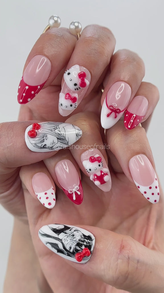 Video showing Rai's House of Nails 3D white kitty press on nails in motion, with the sculpted bows and charms catching the light.