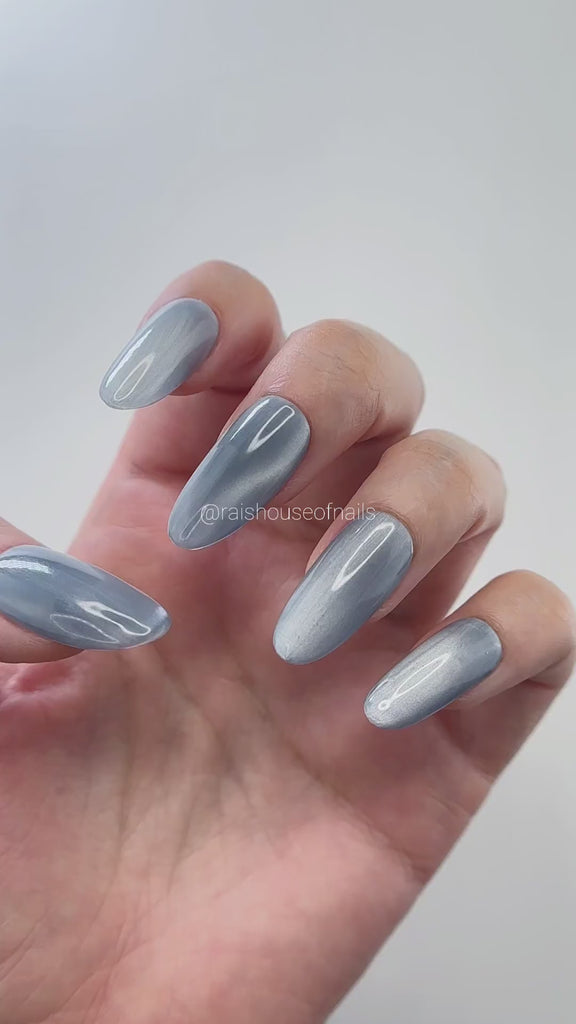 Video of Blue gray velvet cat eye press on nails shimmering as the hand moves, round medium, by Rai's House of Nails.